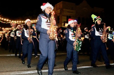 Liberty Middle School's Marching Band and Color Guard plays its way down D Street.